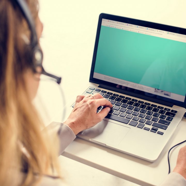 CaseGuard-caucasian-call-center-woman-working-on-laptop
