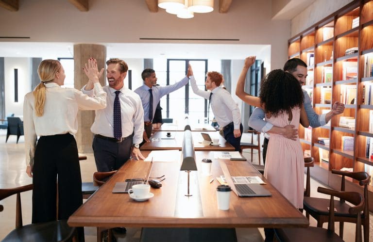 CaseGuard-six-colleagues-celebrating-success-in-an-open-plan