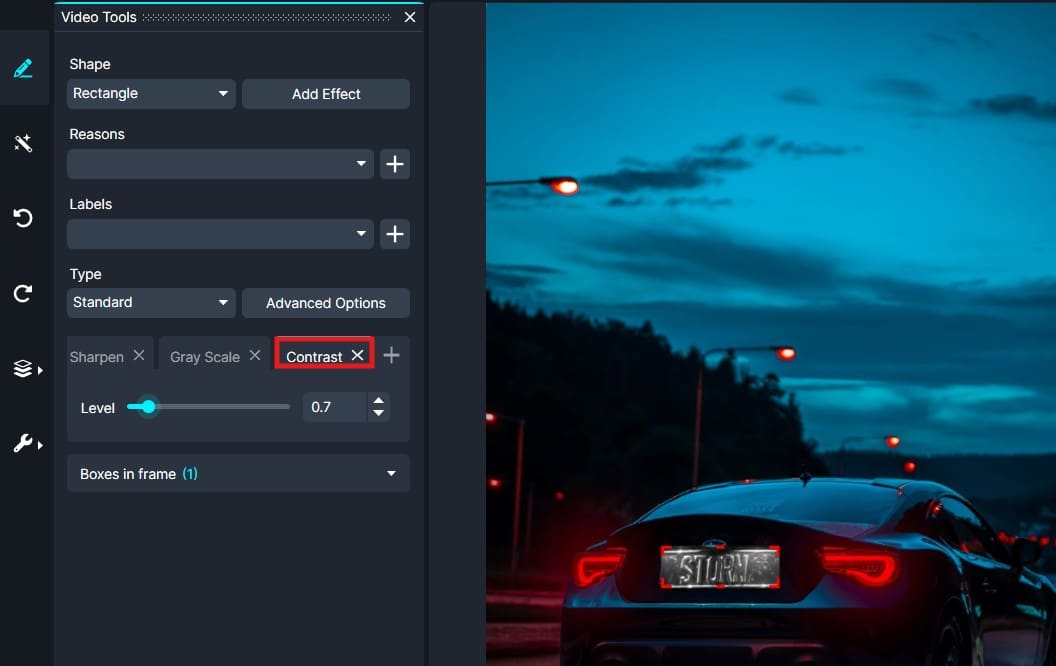 Screenshot of video editing software showing the contrast adjustment panel and a blue nighttime car scene in the preview area.