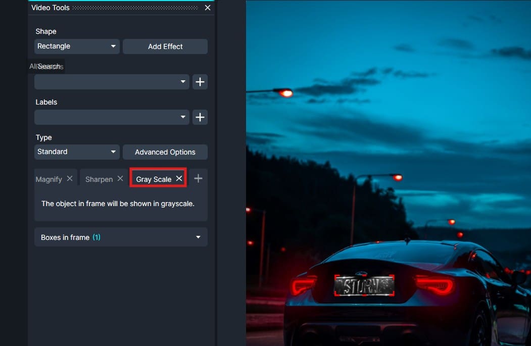 Screenshot of a video editor with a grayscale effect (Gray Scale) applied to a car photo on a street at dusk.