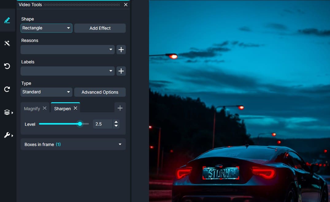 Rear view of a dark blue sports car on a street at dusk with red taillights; a photo editing panel is visible on the left edge.
