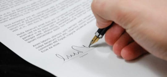 Man signing document